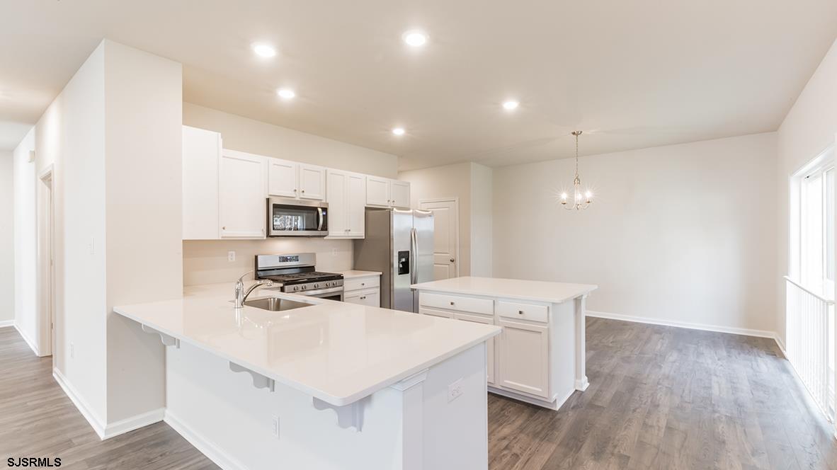 1564 Somers Point Road Egg Harbor Township, NJ 08234 - Photo 3 of 19 a kitchen with a sink a stove a refrigerator and a microwave