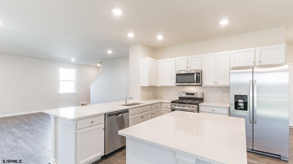 1564 Somers Point Road Egg Harbor Township, NJ 08234 - Photo 10 of 19 a kitchen with cabinets a sink and stainless steel appliances