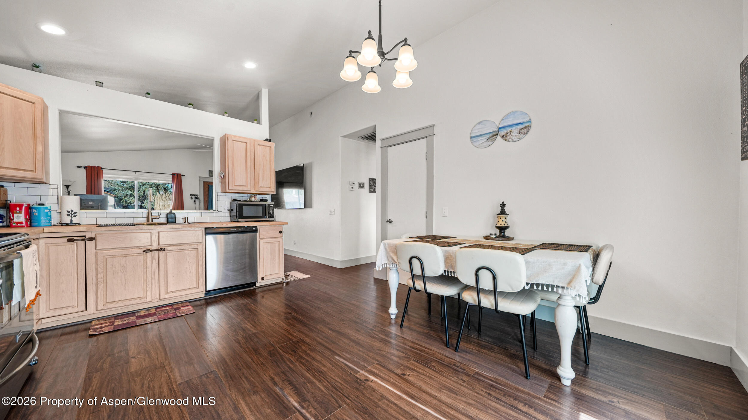 1546 Arabian Avenue Rifle, CO 81650 - Photo 9 of 29 a view of a dining room with furniture and wooden floor