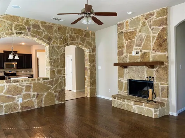 a view of a livingroom with furniture and a fireplace
