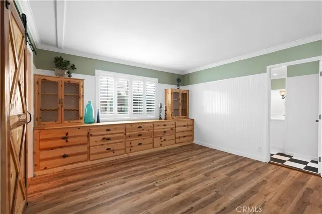 a view of room with window and cabinet
