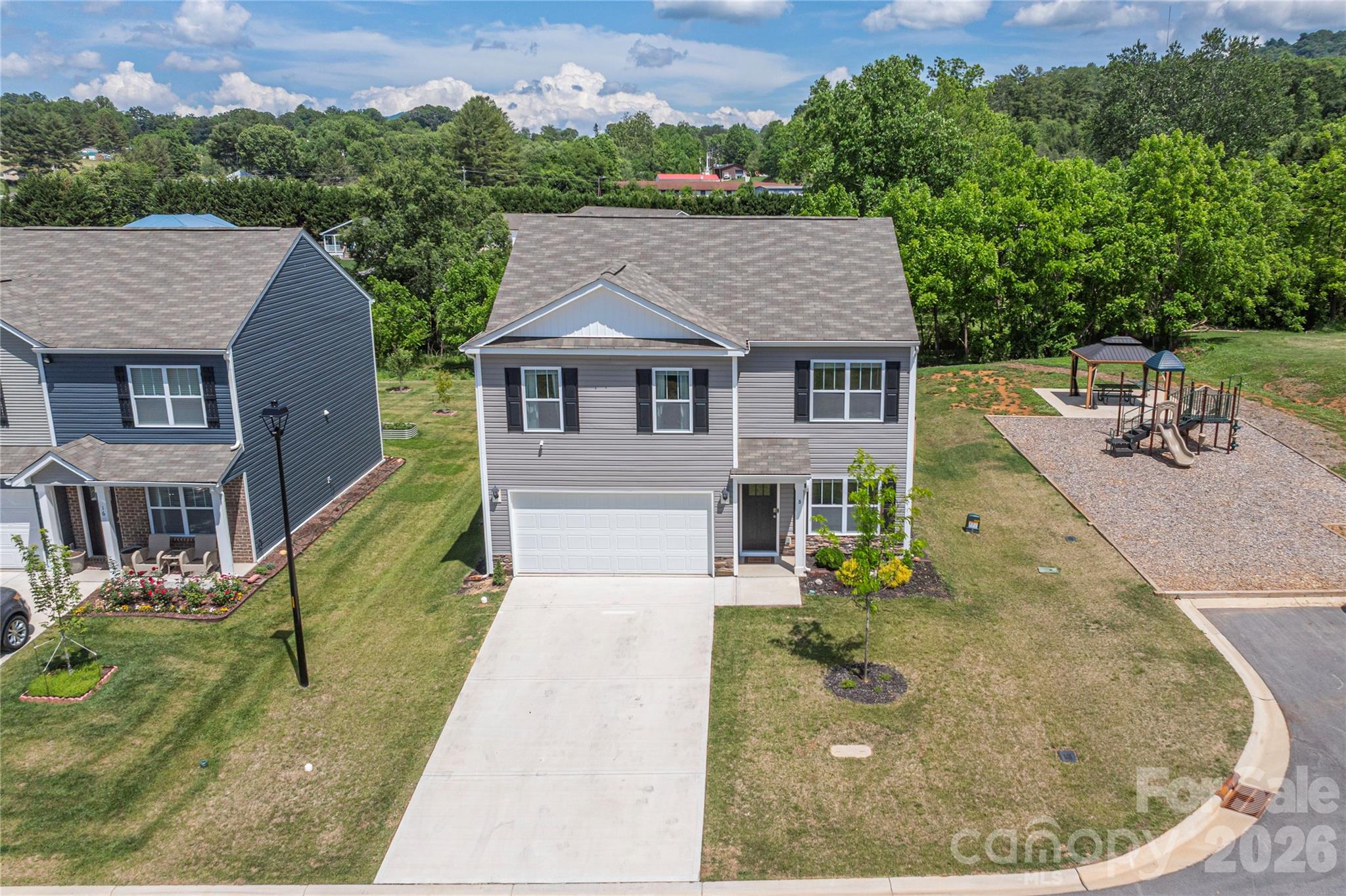 8 Madelyn Drive Clyde, NC 28721 - Photo 3 of 43 aerial view of a house with a garden