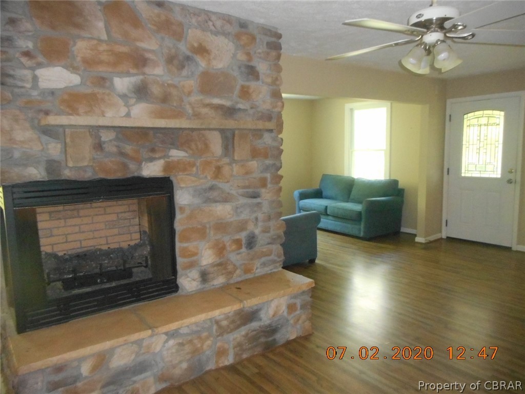 808 Remo Road Heathsville, VA 22473 - Photo 9 of 19 Beautiful stone fireplace is visible from living room, dining room and kitchen.