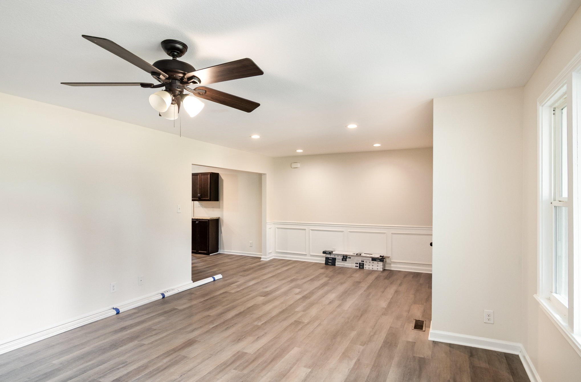 2557 Woodlawn Road Woodlawn, TN 37191 - Photo 12 of 40 an empty room with wooden floor fan and windows