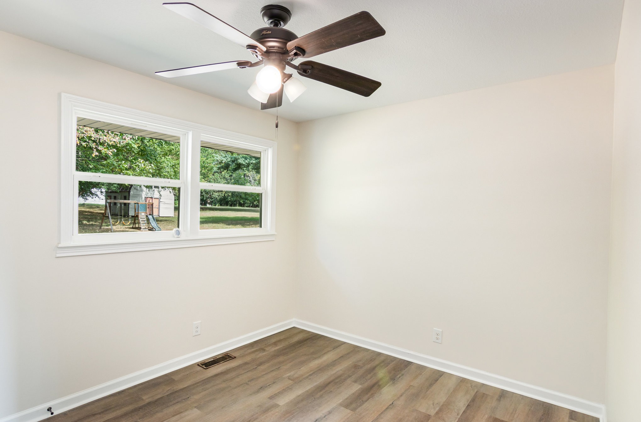 2557 Woodlawn Road Woodlawn, TN 37191 - Photo 21 of 40 an empty room with a window and a fan