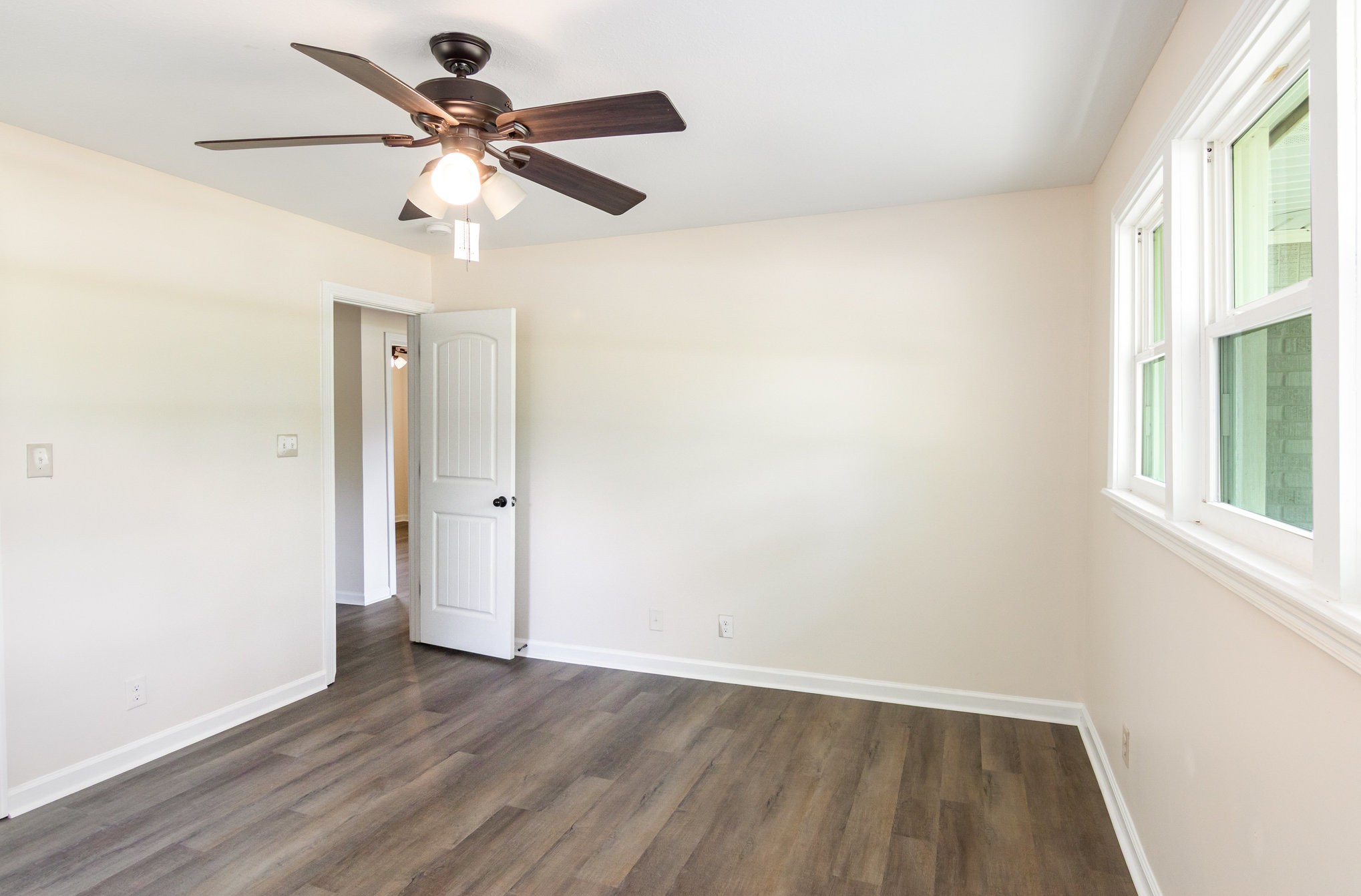 2557 Woodlawn Road Woodlawn, TN 37191 - Photo 30 of 40 wooden floor in an empty room with a window