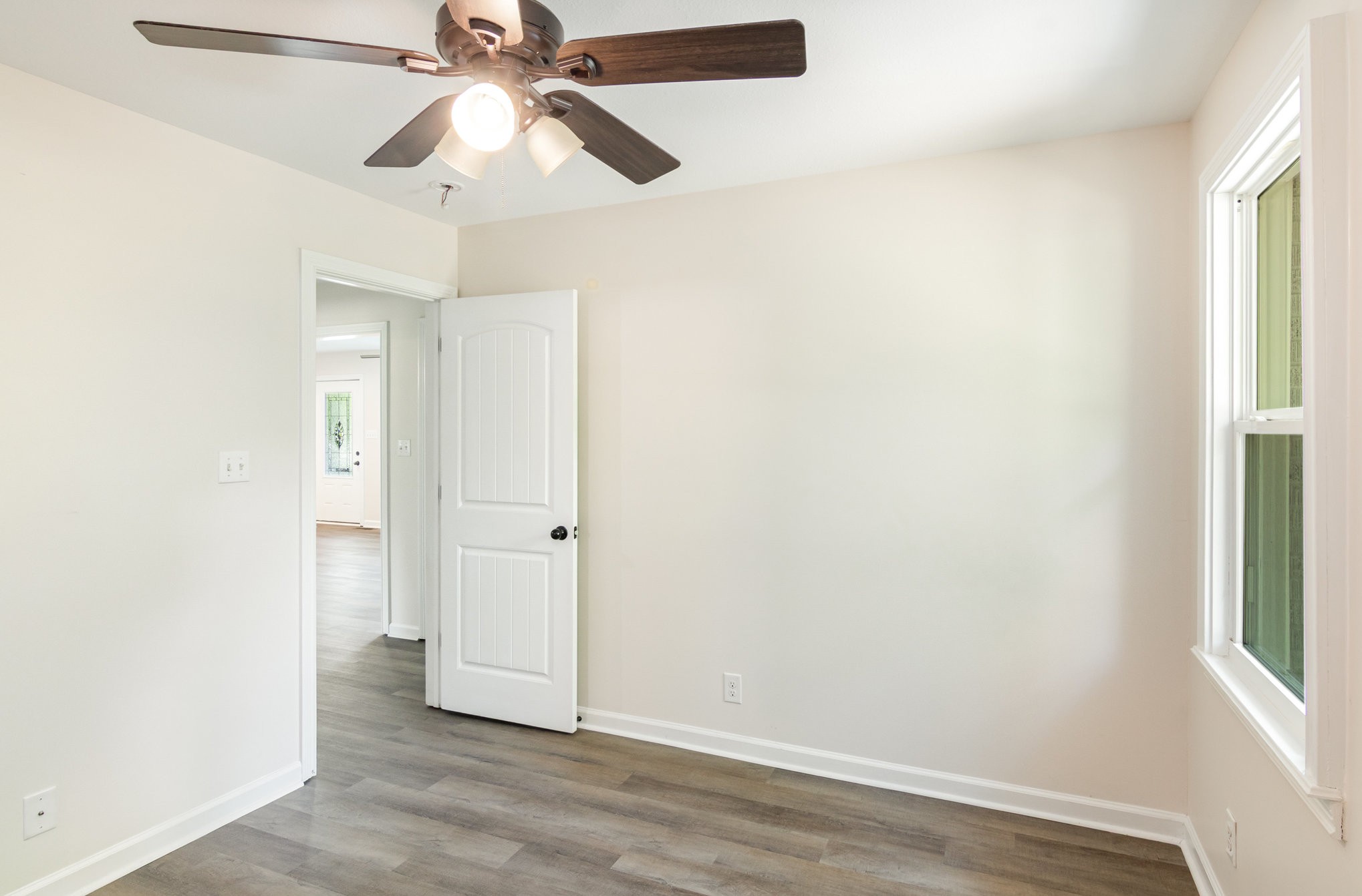2557 Woodlawn Road Woodlawn, TN 37191 - Photo 33 of 40 an empty room with fan and windows