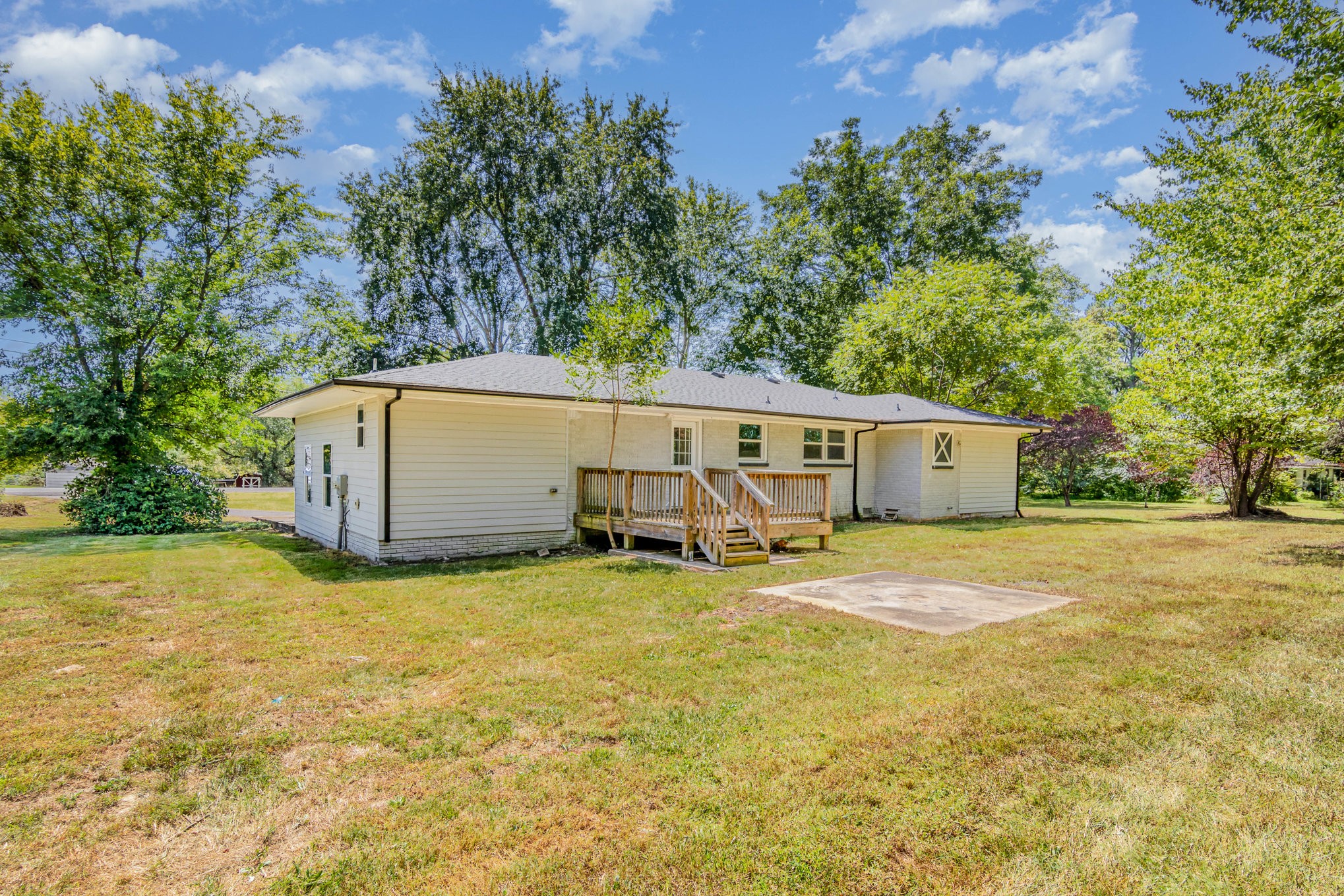 2557 Woodlawn Road Woodlawn, TN 37191 - Photo 39 of 40 a view of a house with backyard and trees