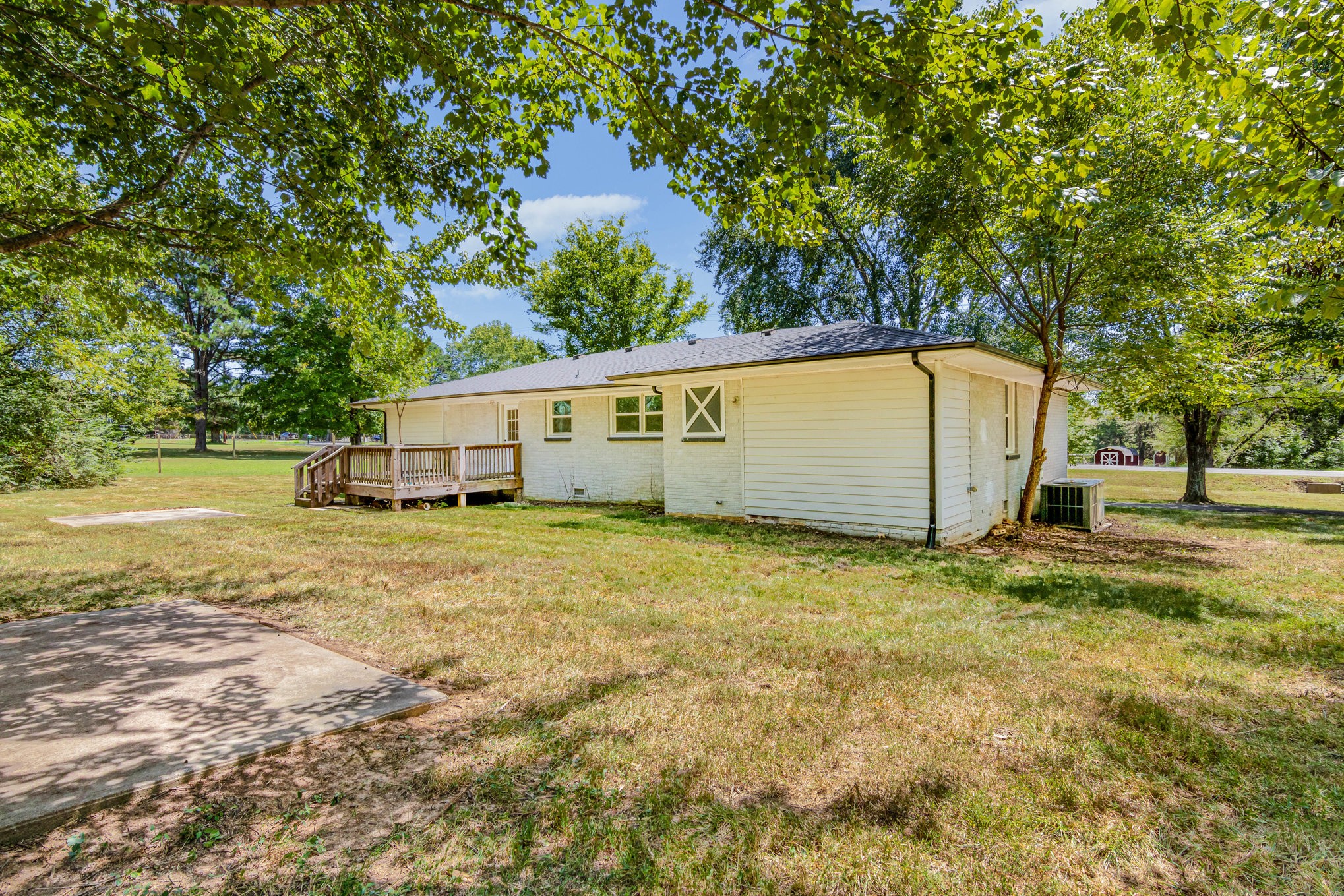 2557 Woodlawn Road Woodlawn, TN 37191 - Photo 40 of 40 a view of a house with backyard and tree