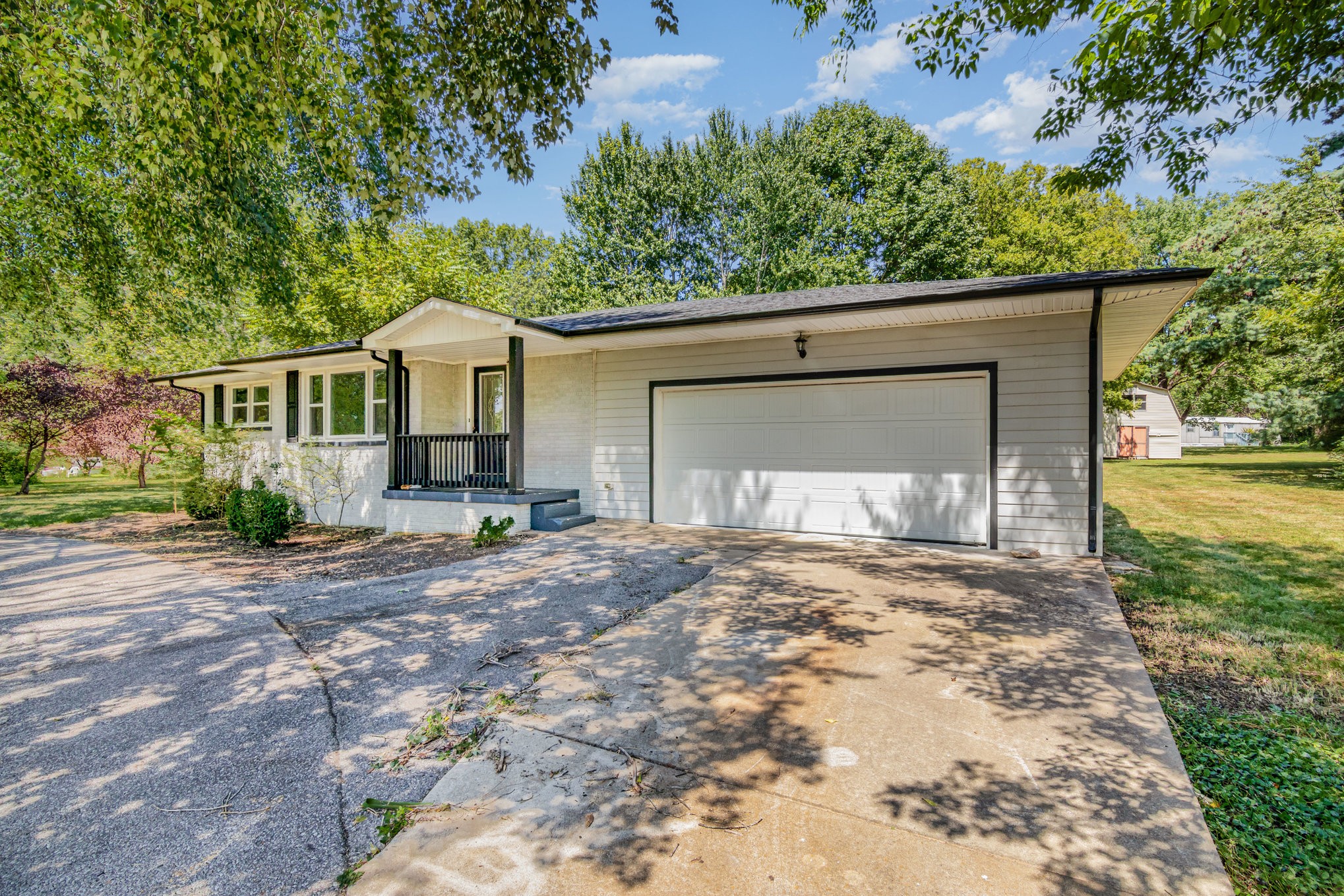 2557 Woodlawn Road Woodlawn, TN 37191 - Photo 4 of 40 a front view of a house with garden