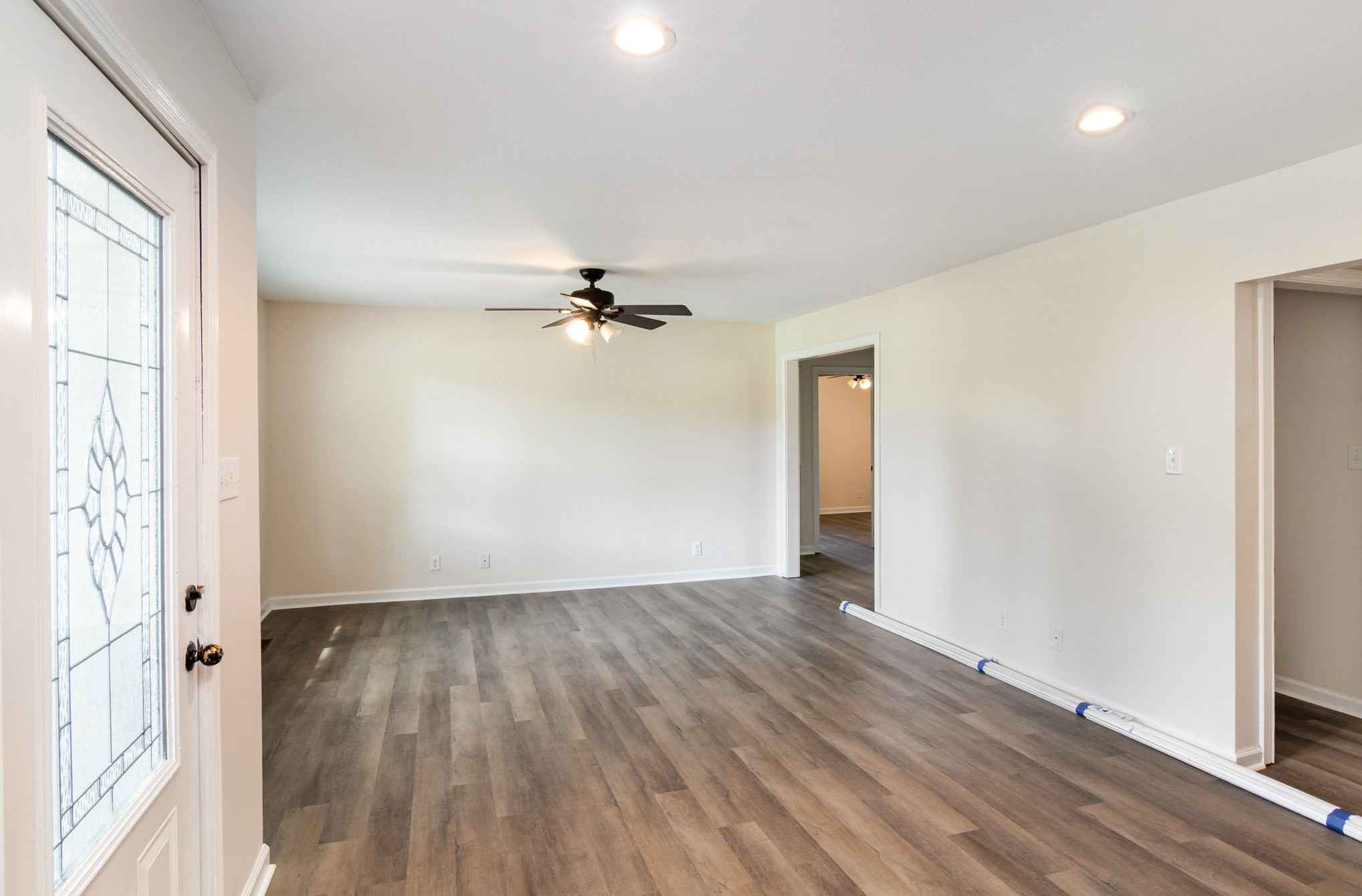 2557 Woodlawn Road Woodlawn, TN 37191 - Photo 7 of 40 a view of an empty room with wooden floor and a window