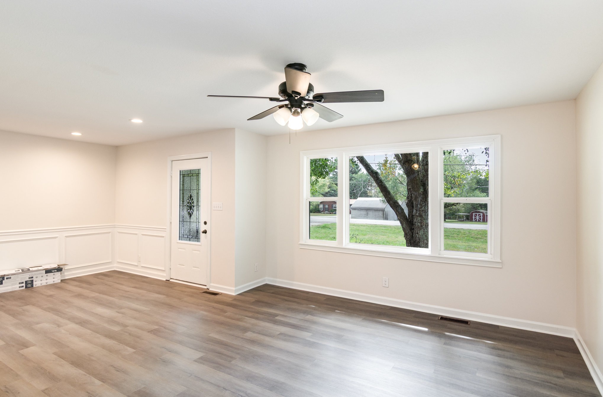 2557 Woodlawn Road Woodlawn, TN 37191 - Photo 10 of 40 wooden floor in an empty room with a window