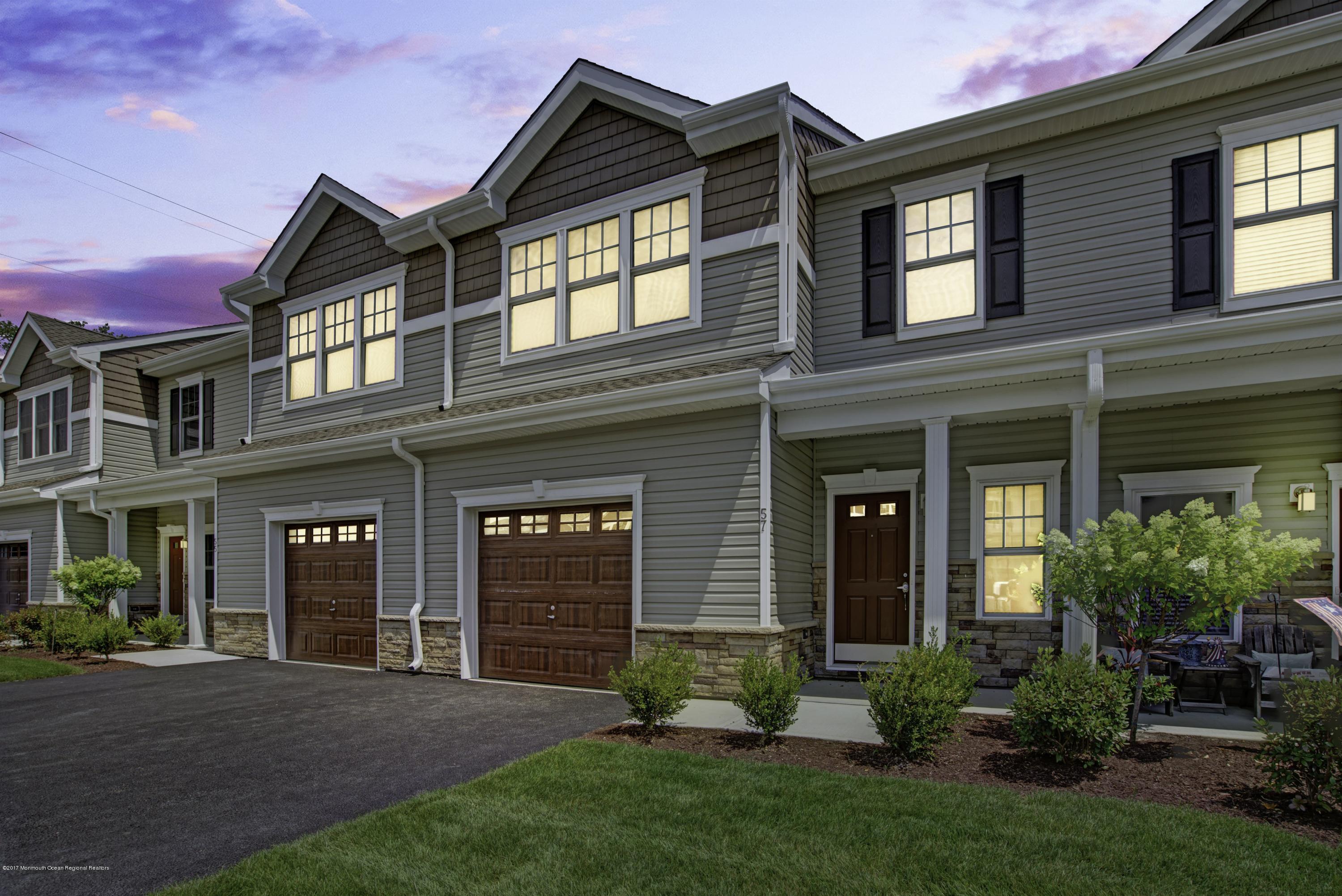 58 Rockingham Way Manchester Township, NJ 08759 - Photo 1 of 18 front view of a brick house with a yard