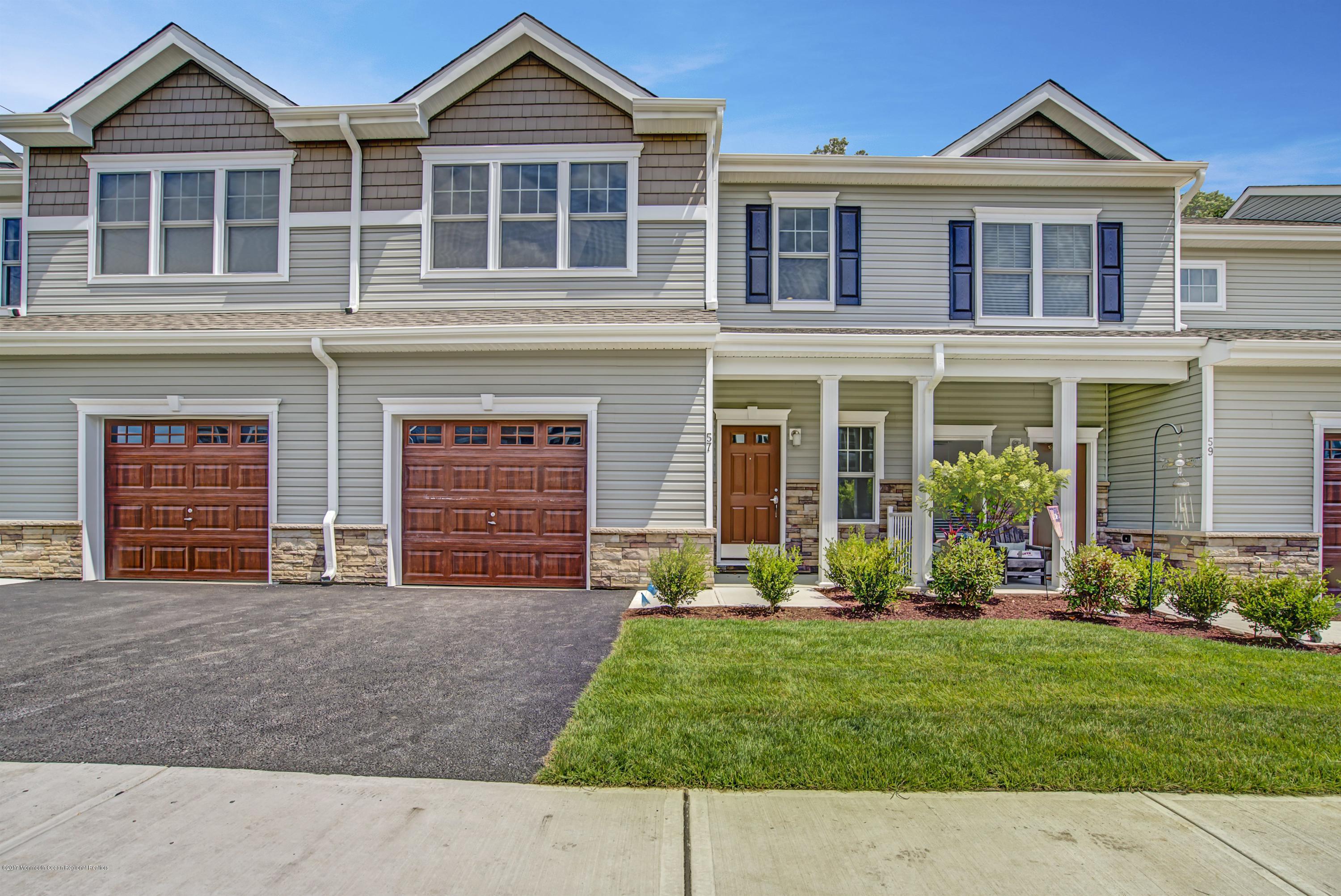 58 Rockingham Way Manchester Township, NJ 08759 - Photo 2 of 18 front view of a house with a yard