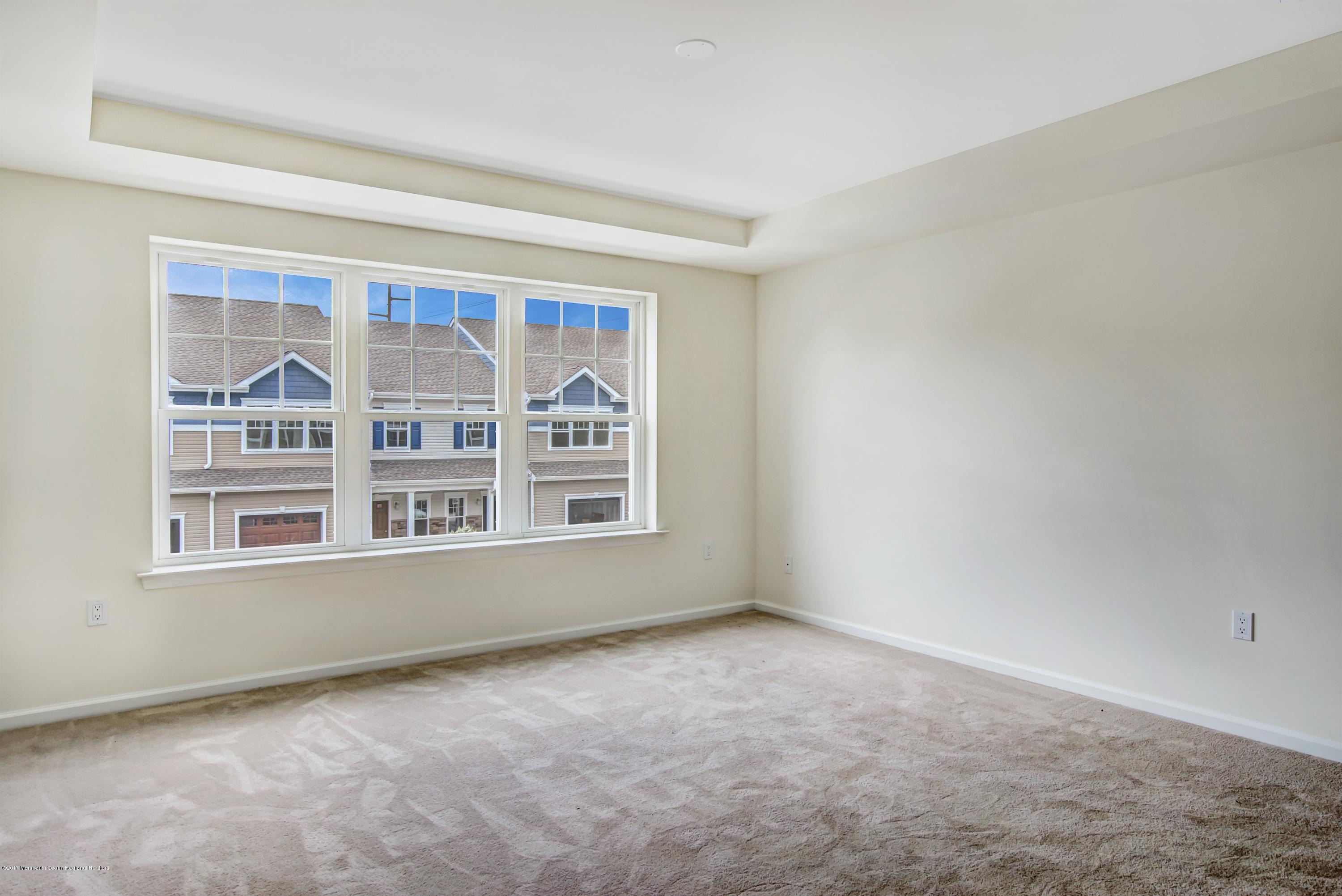 58 Rockingham Way Manchester Township, NJ 08759 - Photo 11 of 18 a view of an empty room with a window