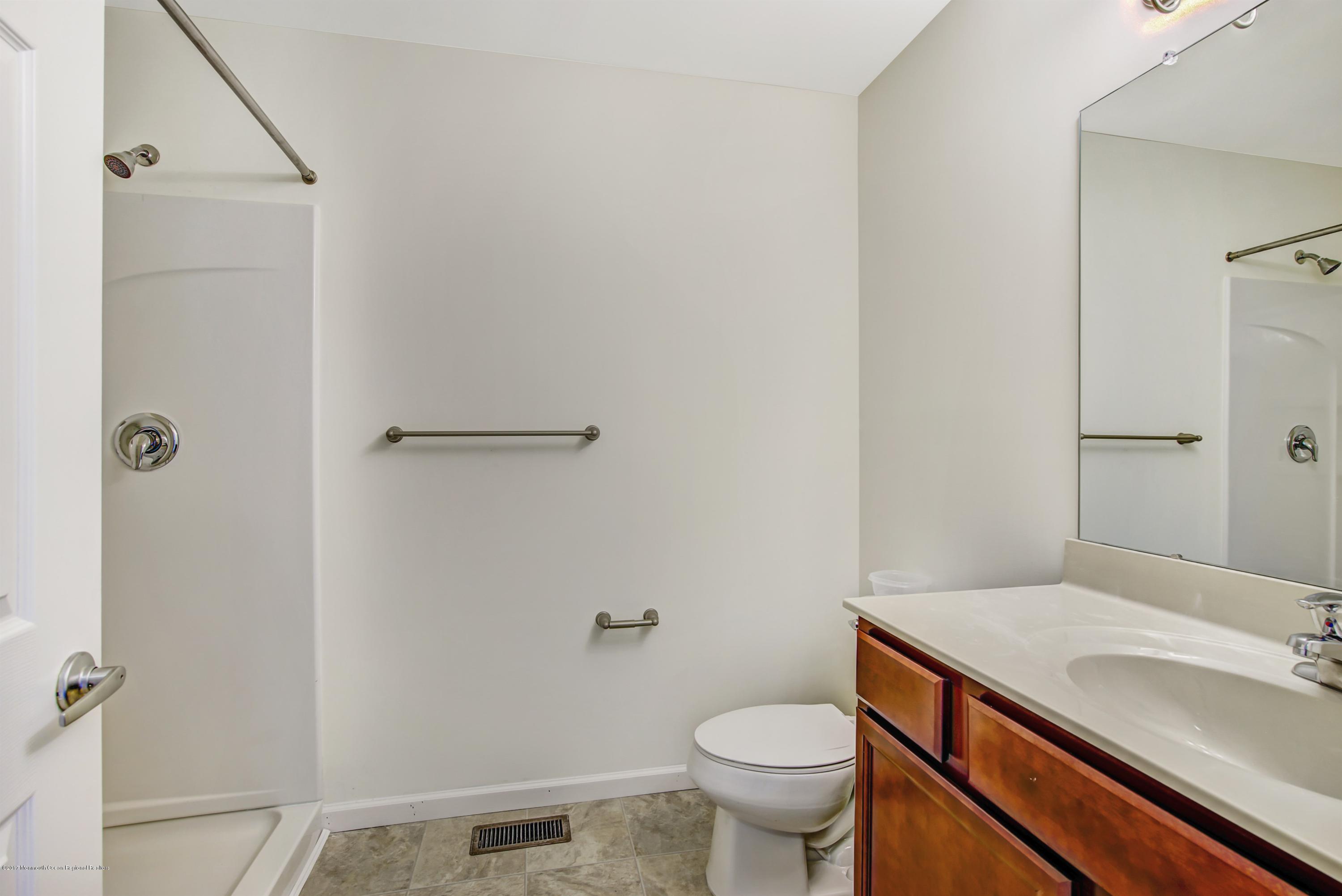 58 Rockingham Way Manchester Township, NJ 08759 - Photo 12 of 18 a bathroom with a sink and toilet