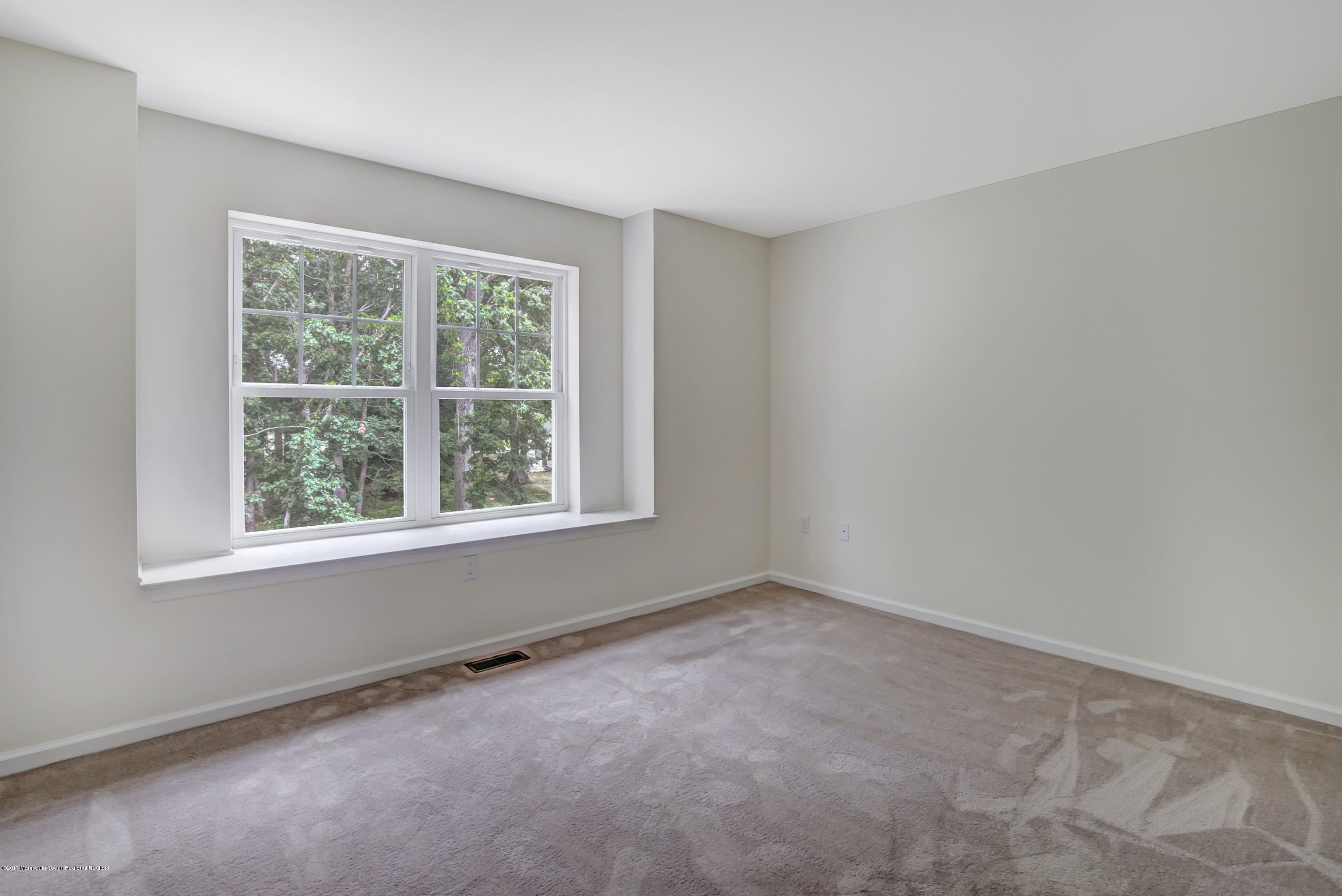 58 Rockingham Way Manchester Township, NJ 08759 - Photo 15 of 18 an empty room with a window