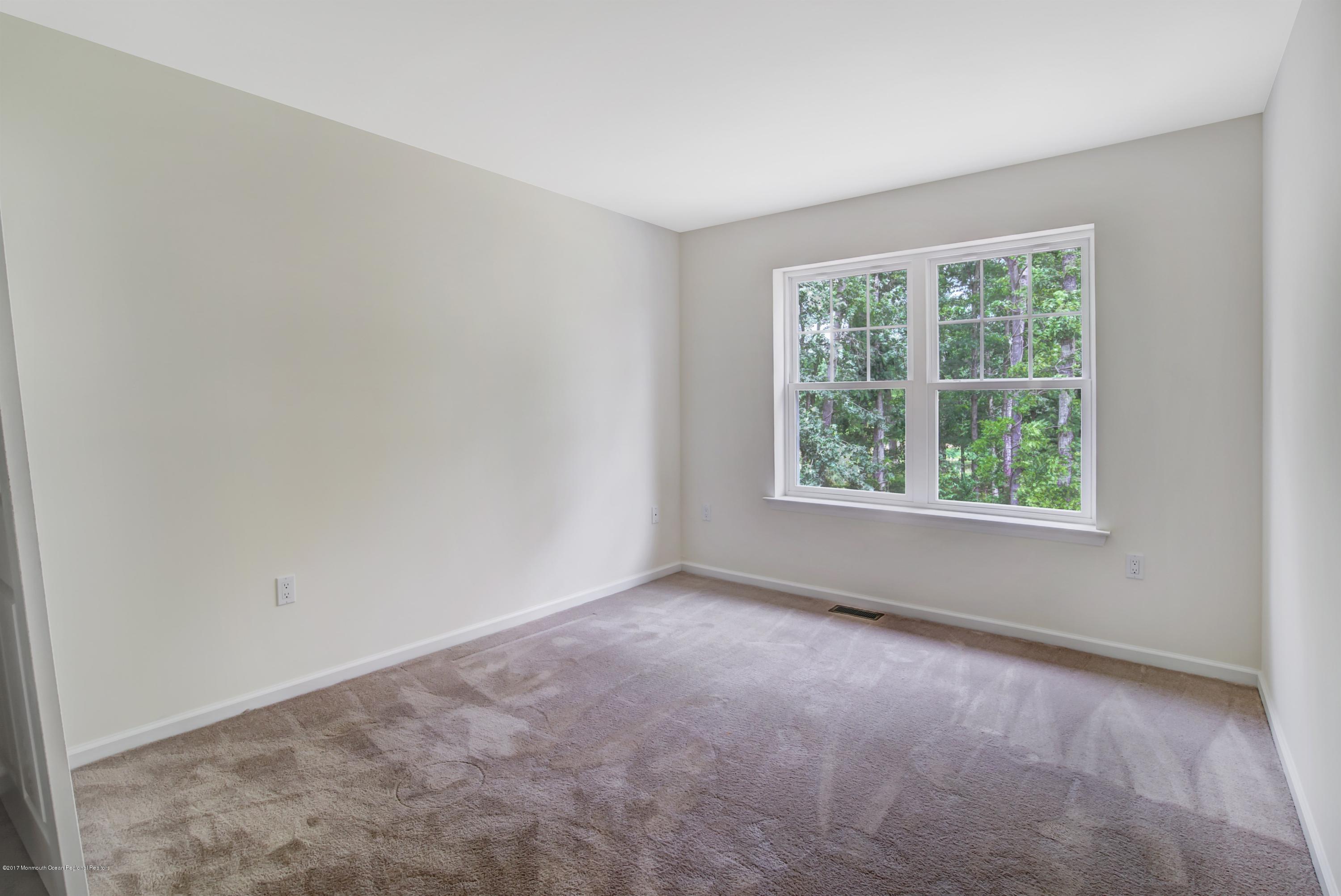 58 Rockingham Way Manchester Township, NJ 08759 - Photo 17 of 18 an empty room with a window