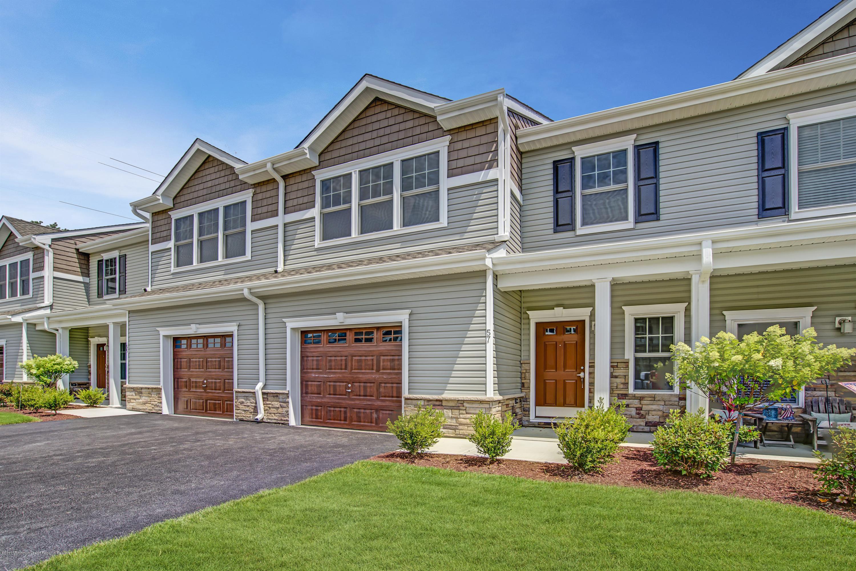 58 Rockingham Way Manchester Township, NJ 08759 - Photo 3 of 18 a front view of a house with garden