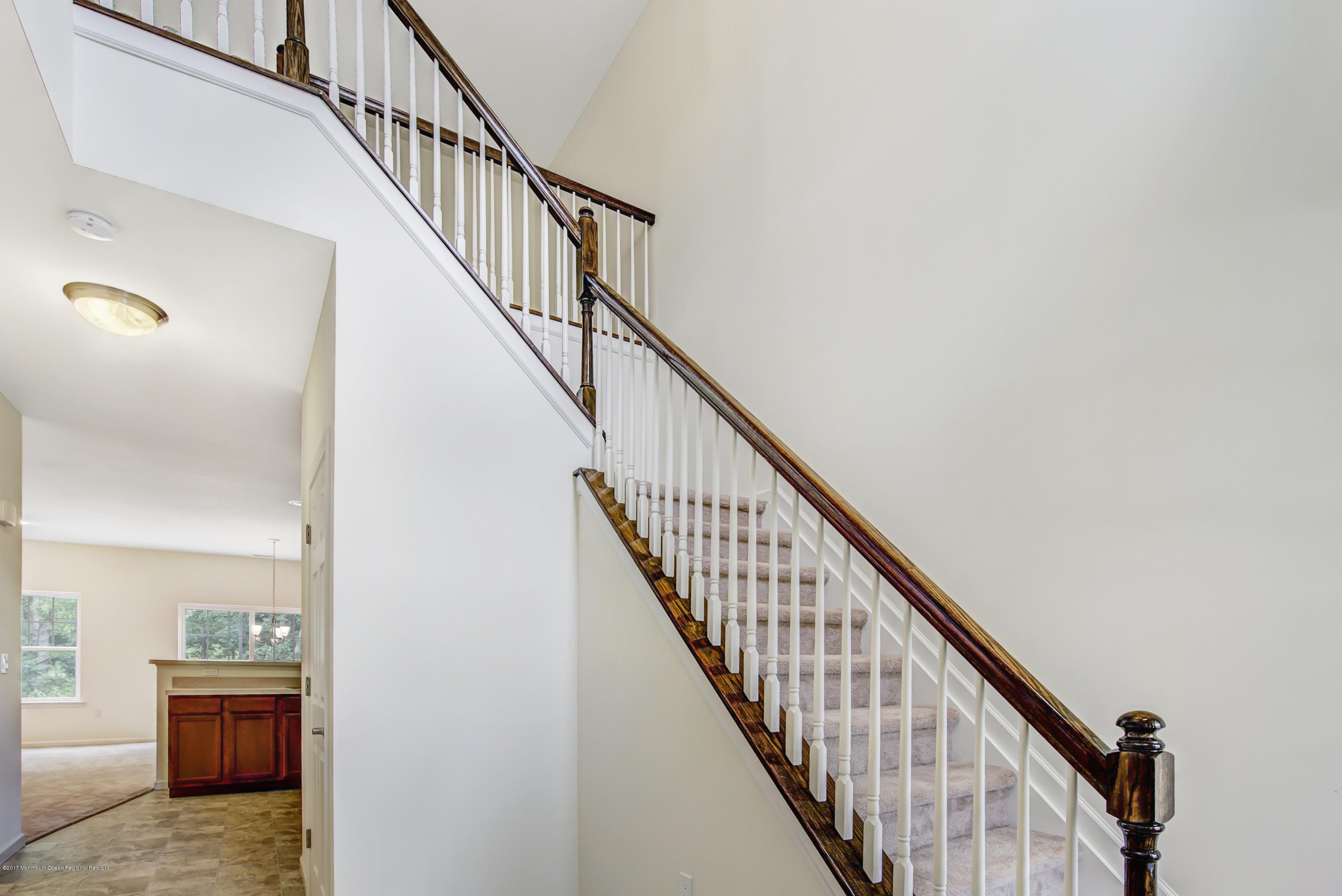 58 Rockingham Way Manchester Township, NJ 08759 - Photo 4 of 18 a view of entryway and hall with wooden floor