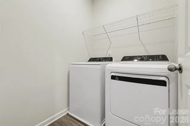 a bathroom with a granite countertop toilet a sink and a bathtub