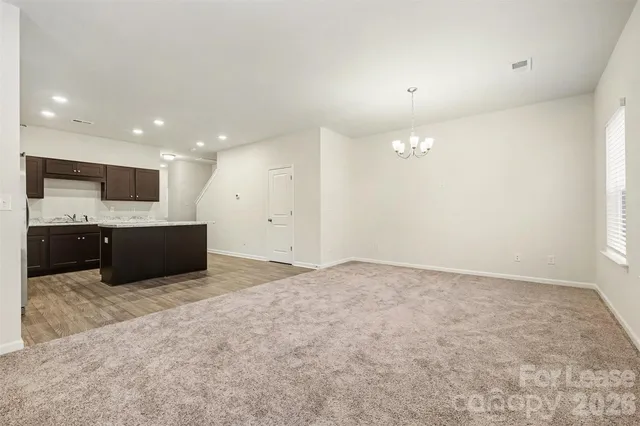 a large room with a large window and a fireplace