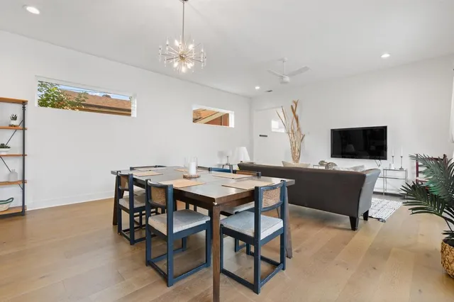 a view of a livingroom with furniture and a flat screen tv