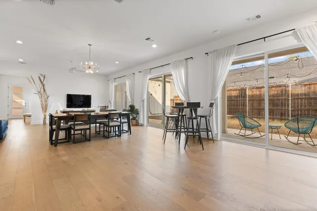 a view of a work space with furniture window and wooden floor