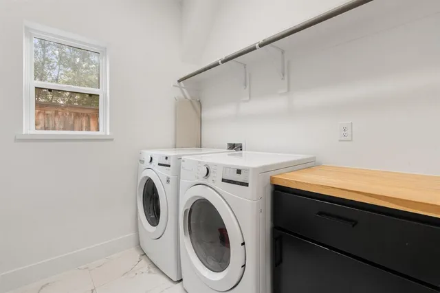 a utility room with dryer and washer