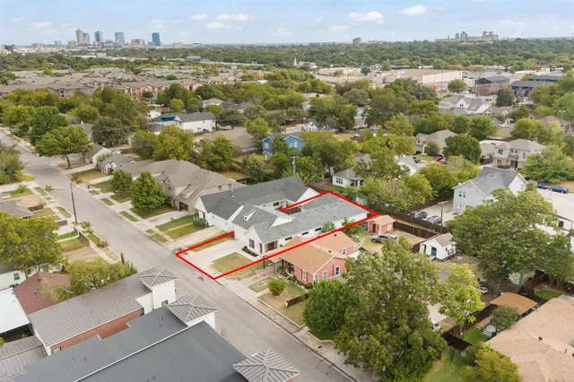 an aerial view of residential houses with outdoor space