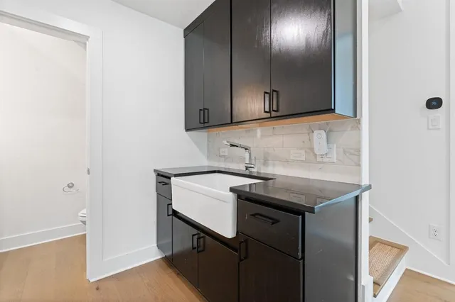 a utility room with cabinets washer and dryer