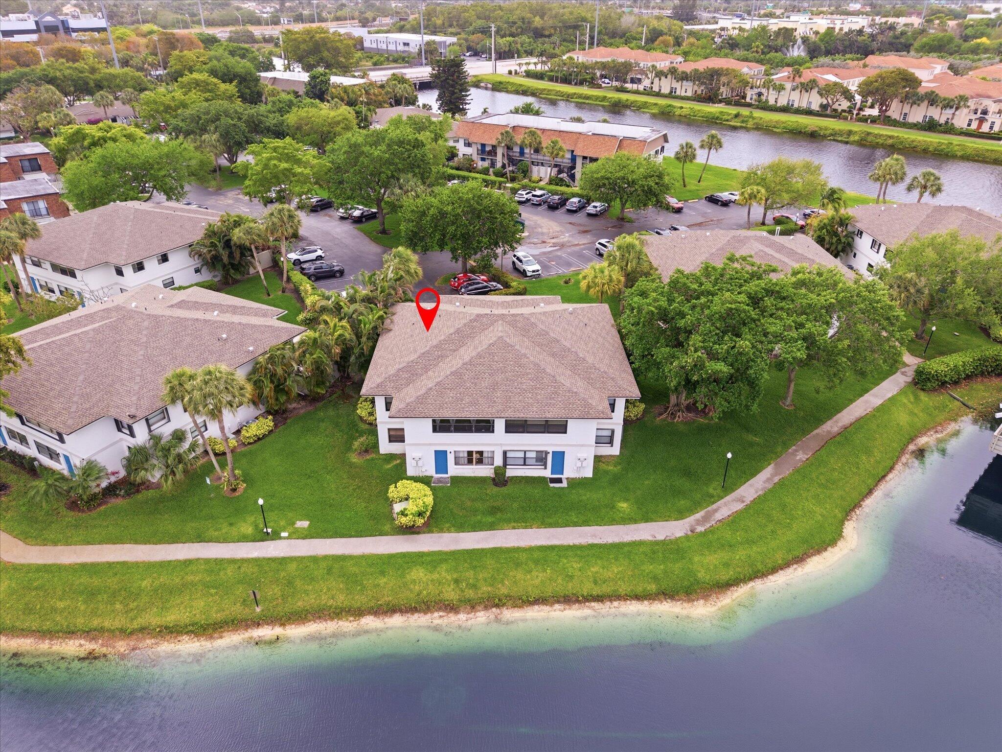 3122 Southwest 20th Terrace, Unit 25B2 Delray Beach, FL 33445 - Photo 19 of 32 an aerial view of a house with a garden and lake view