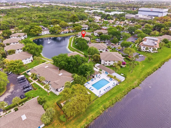 an aerial view of residential houses with outdoor space