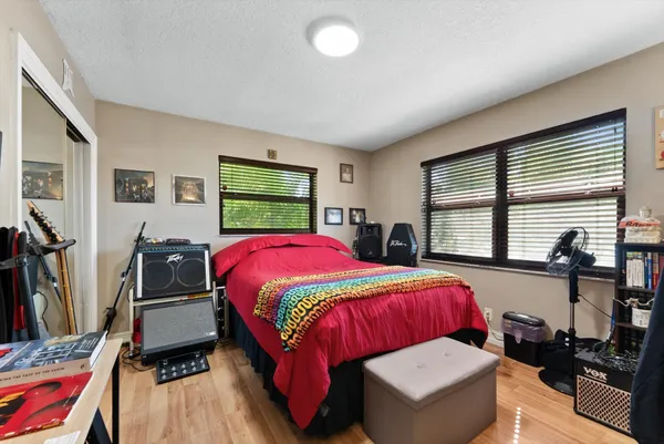 a bedroom with a bed and a table