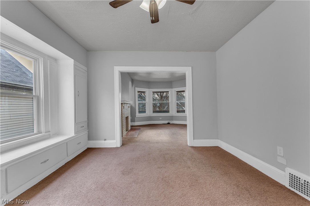 860 Greyton Road Cleveland Heights, OH 44112 - Photo 20 of 31 Carpeted spare room with ceiling fan