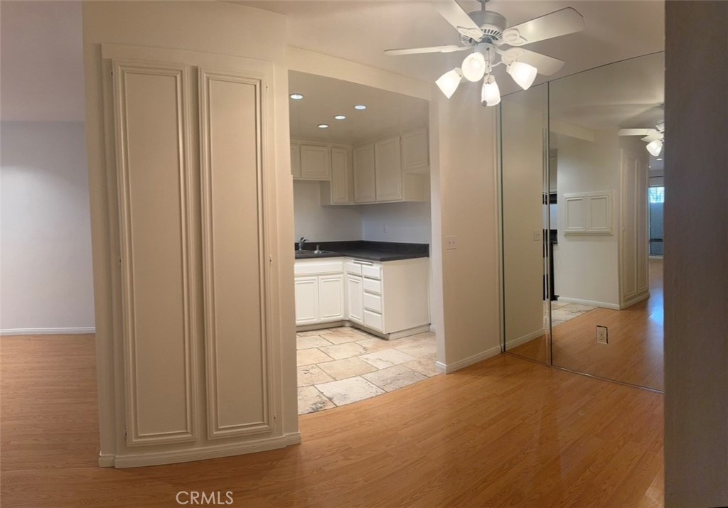 3032 Associated Road, Unit 76 Fullerton, CA 92835 - Photo 12 of 14 a view of a kitchen with a sink and a refrigerator
