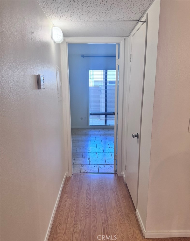 3032 Associated Road, Unit 76 Fullerton, CA 92835 - Photo 3 of 14 a view of hallway with wooden floor