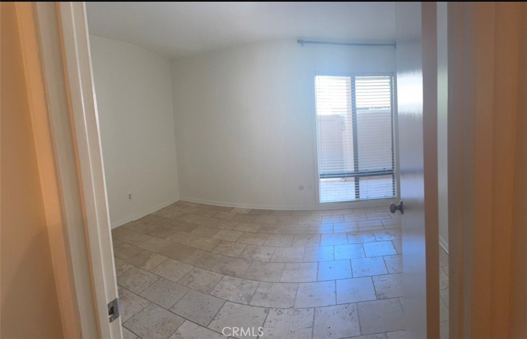 3032 Associated Road, Unit 76 Fullerton, CA 92835 - Photo 4 of 14 a view of an empty room with a window