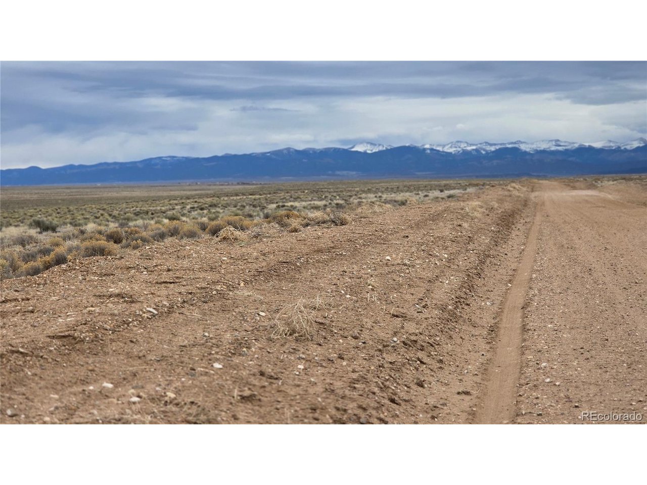 3 Russ Road Sanford, CO 81151 - Photo 11 of 11 a black and white photo of a field