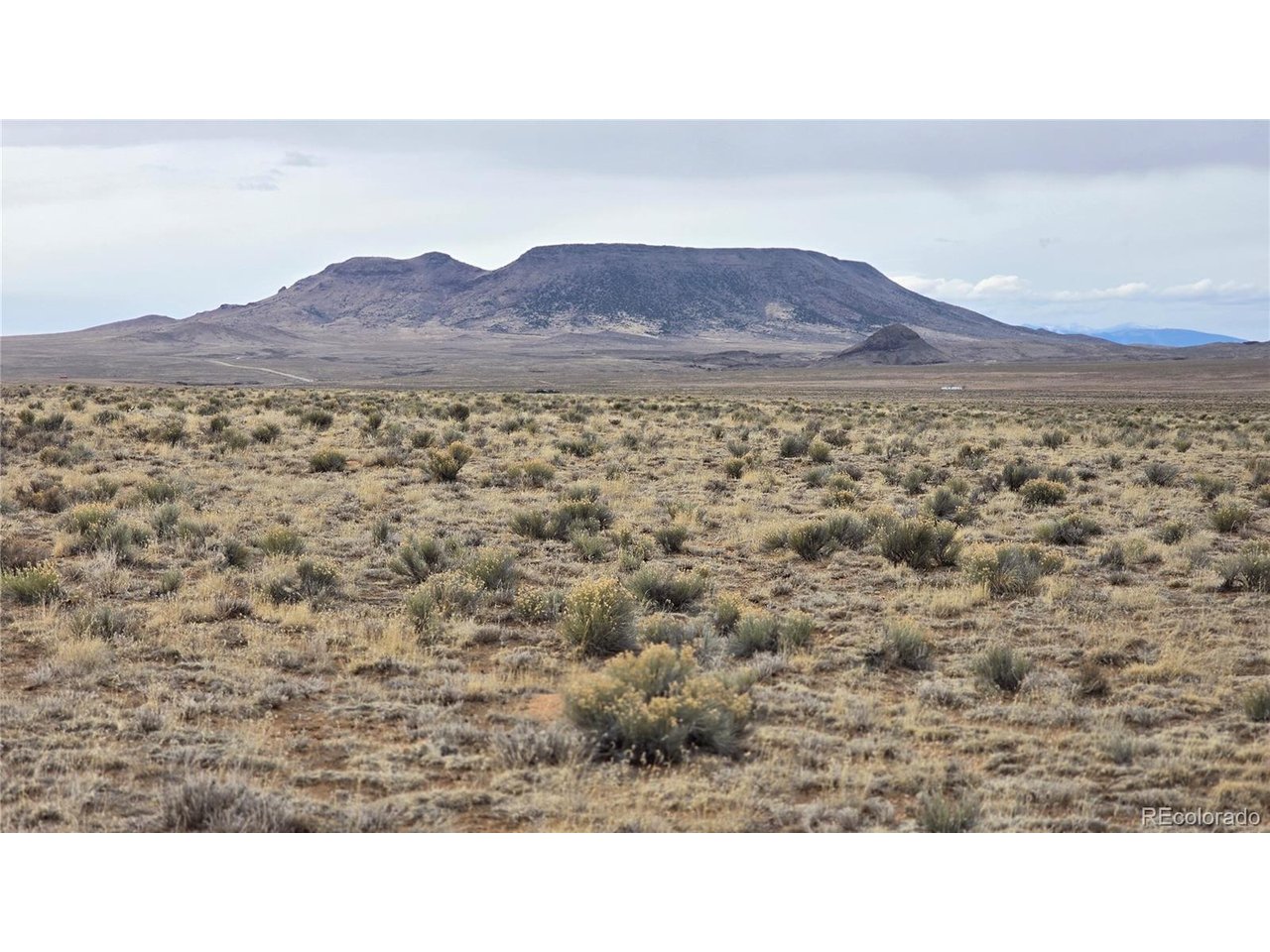 3 Russ Road Sanford, CO 81151 - Photo 2 of 11 a black and white photo of a field
