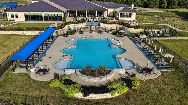 swimming pool view with a seating space