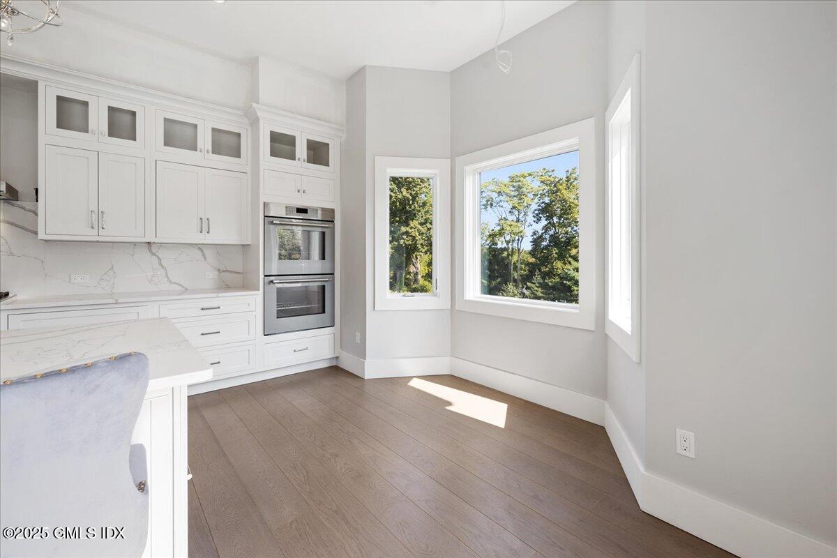 424 Taconic Road Greenwich, CT 06831 - Photo 12 of 35 a view of a kitchen with wooden floor and a window