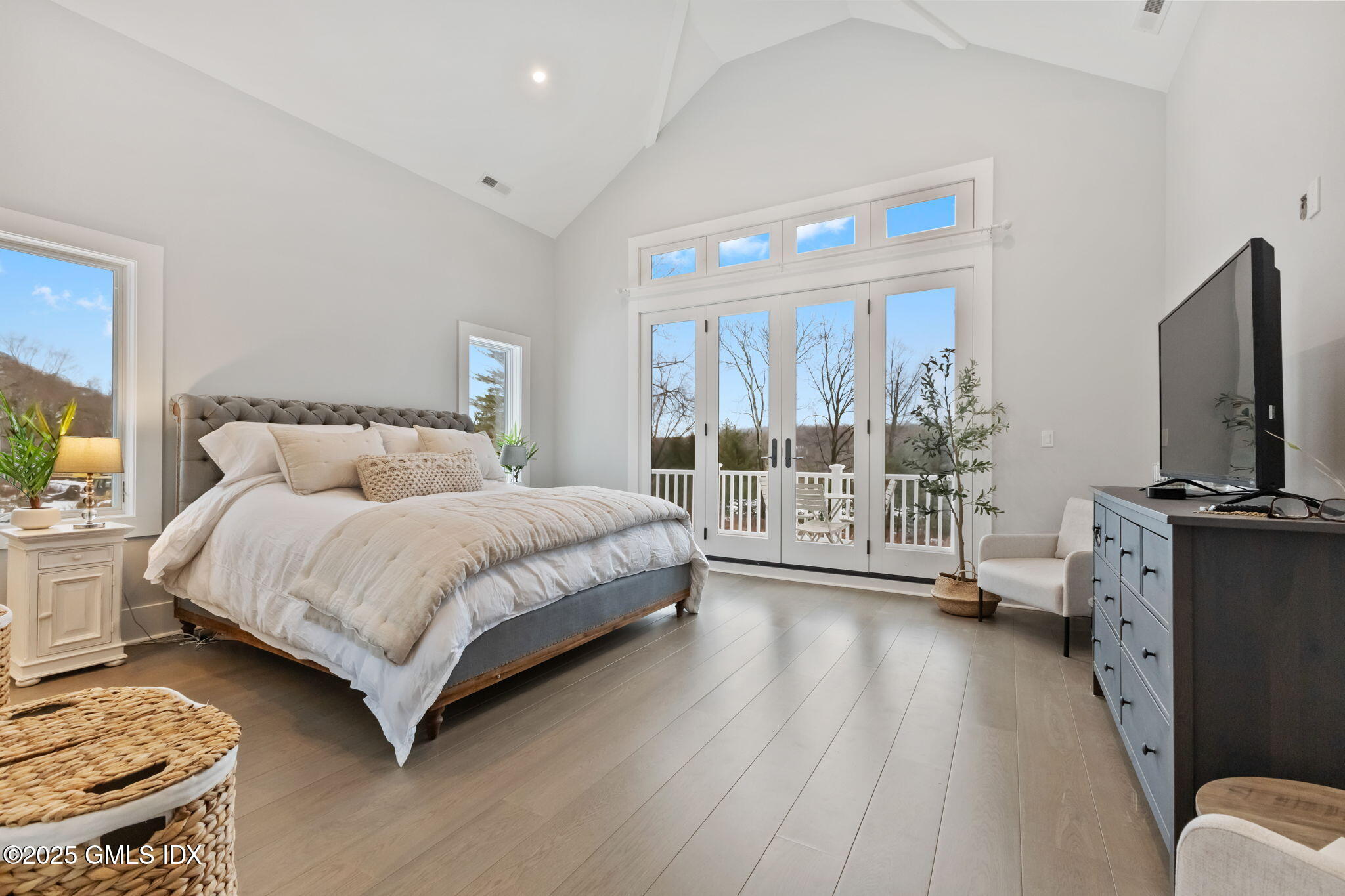 424 Taconic Road Greenwich, CT 06831 - Photo 14 of 35 a bedroom with a bed and large window