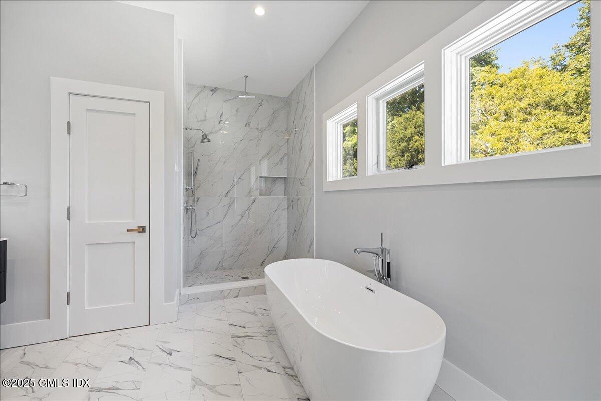 424 Taconic Road Greenwich, CT 06831 - Photo 16 of 35 a white bath tub sitting next to a white sink