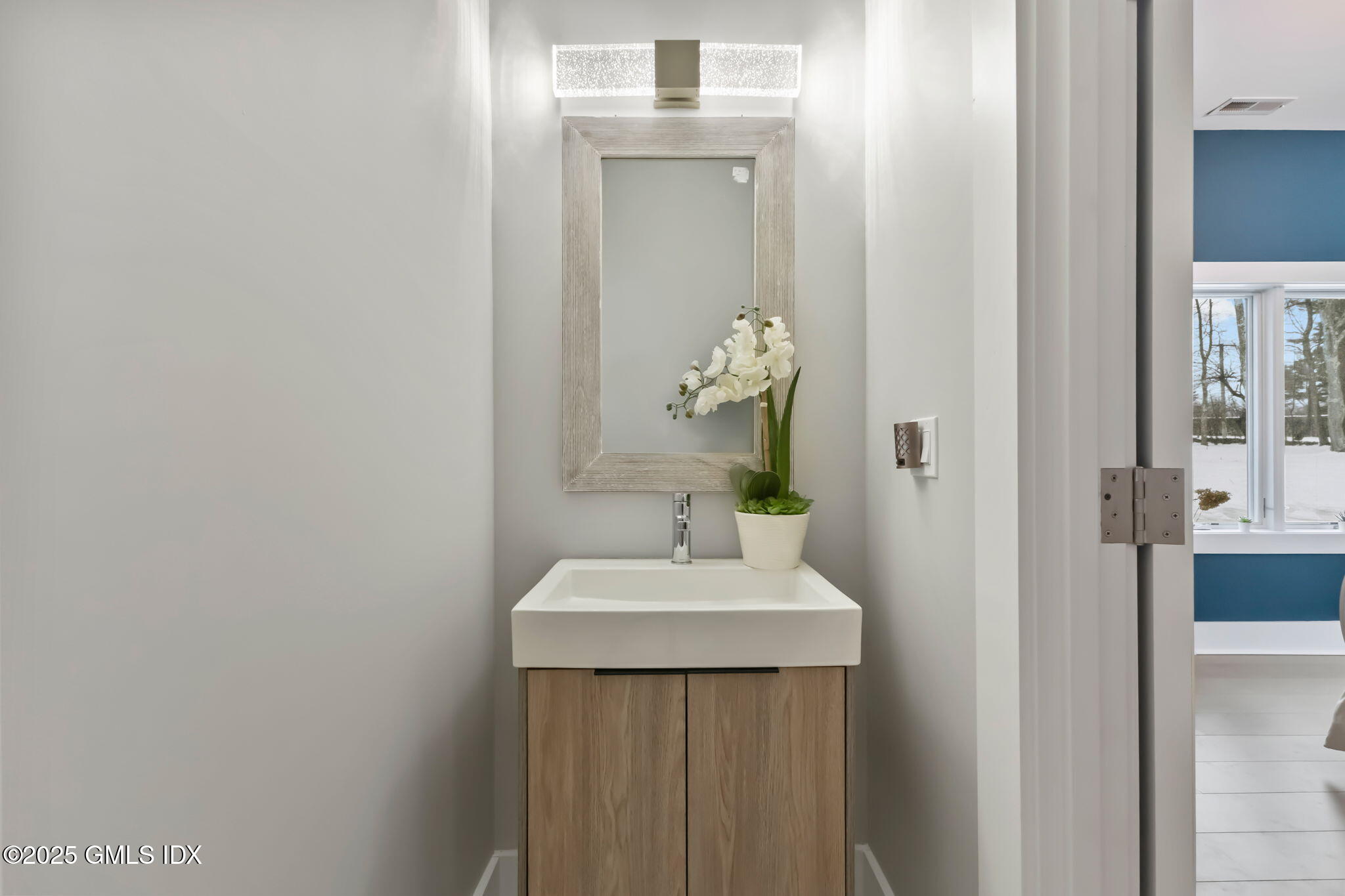 424 Taconic Road Greenwich, CT 06831 - Photo 19 of 35 a bathroom with a sink and a mirror
