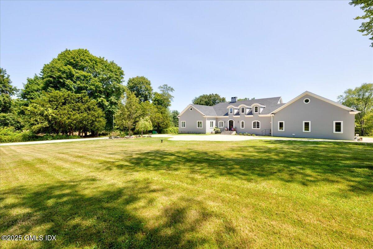 424 Taconic Road Greenwich, CT 06831 - Photo 2 of 35 a view of house with swimming pool