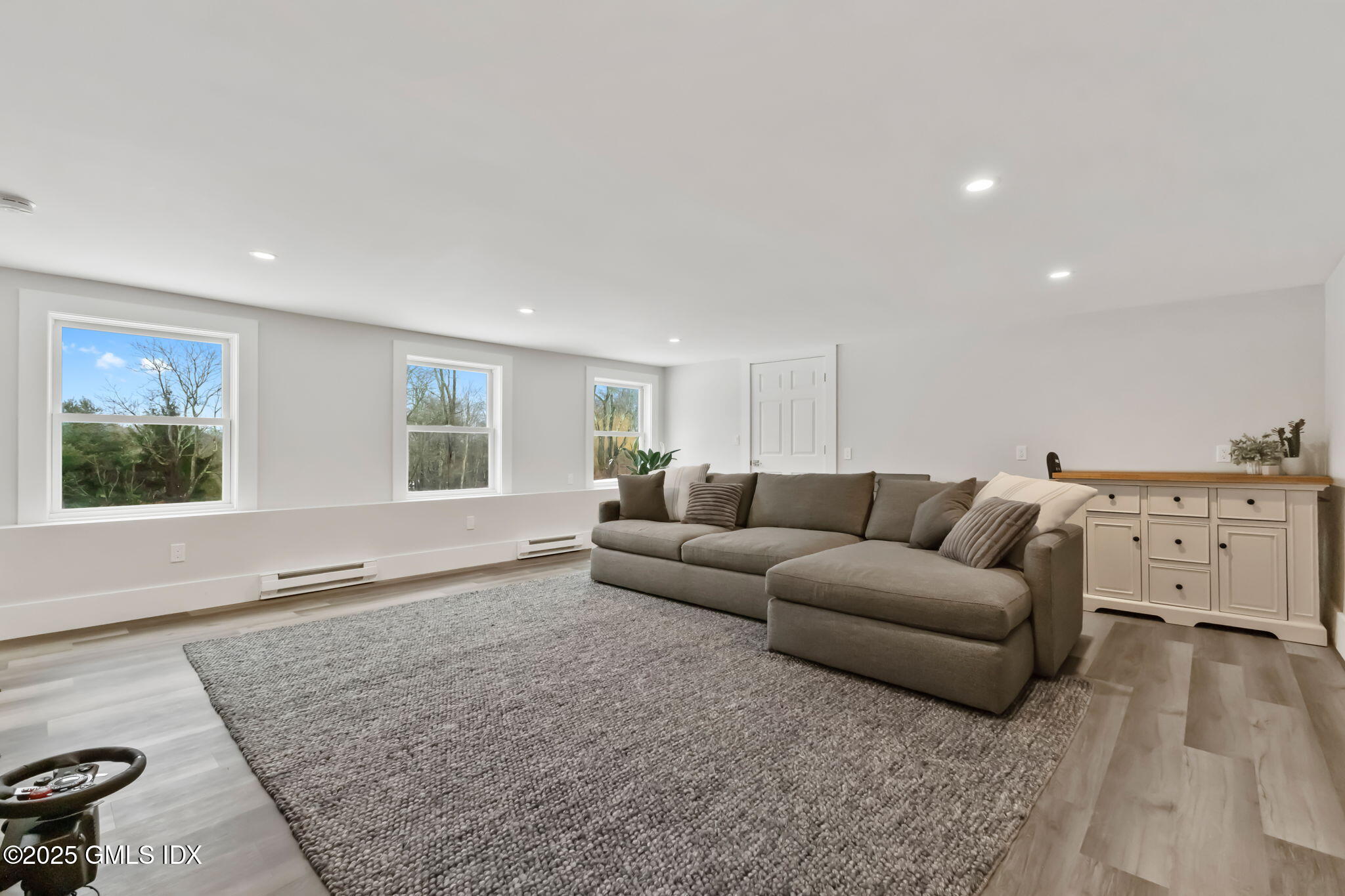 424 Taconic Road Greenwich, CT 06831 - Photo 25 of 35 a living room with furniture and a window