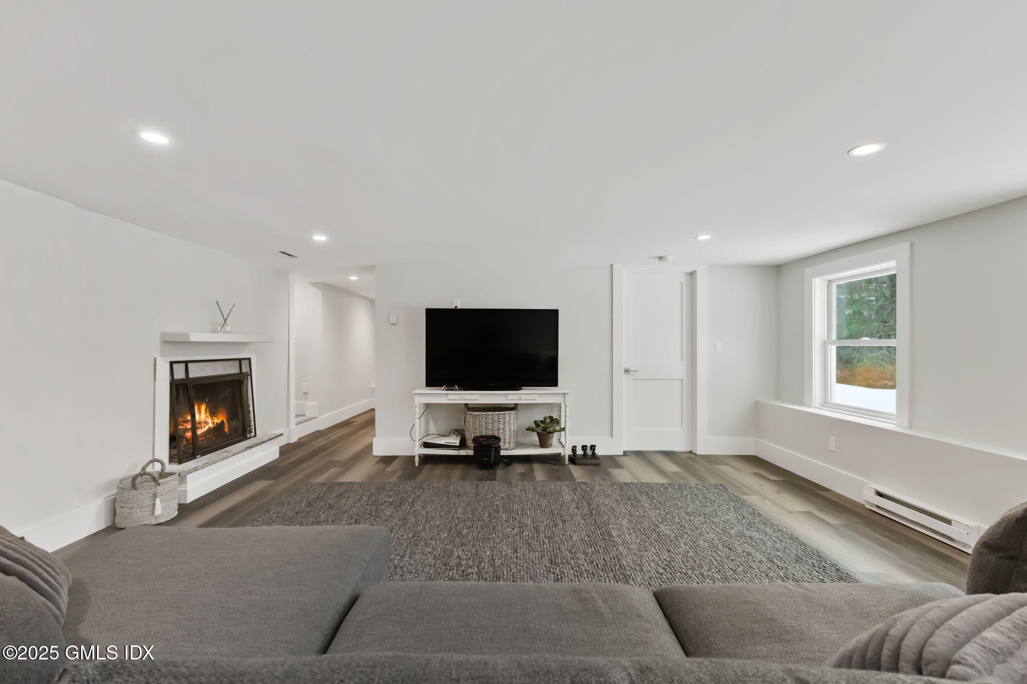 424 Taconic Road Greenwich, CT 06831 - Photo 26 of 35 a living room with furniture and a flat screen tv