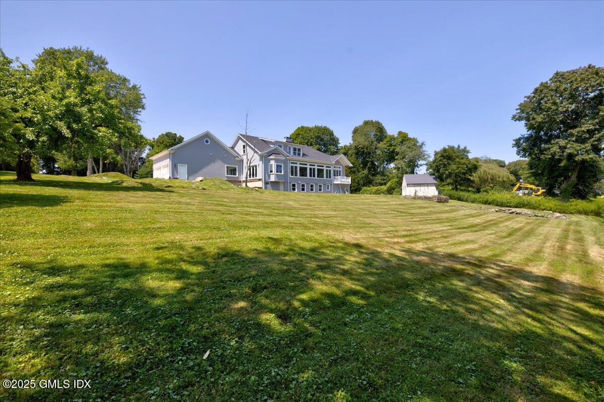 424 Taconic Road Greenwich, CT 06831 - Photo 28 of 35 a view of a town with floor to ceiling window and trees