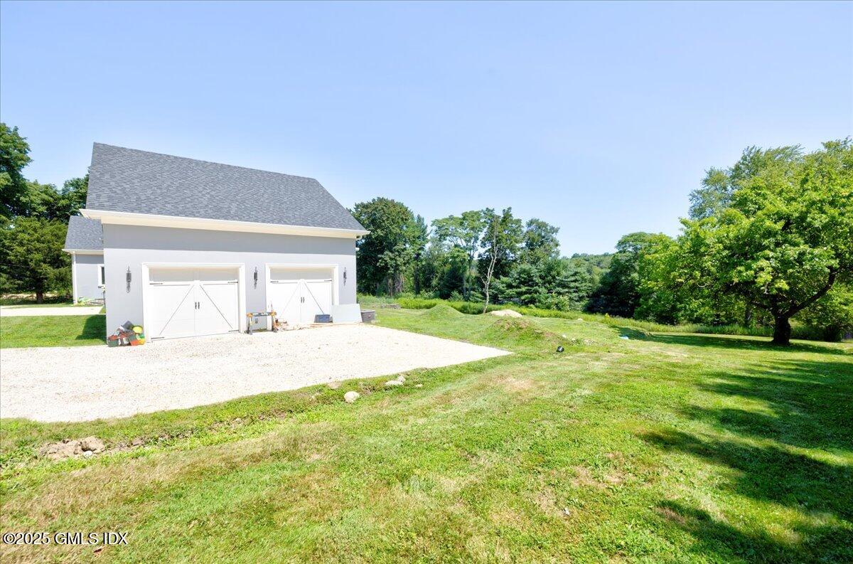 424 Taconic Road Greenwich, CT 06831 - Photo 31 of 35 a view of a house with backyard and trees